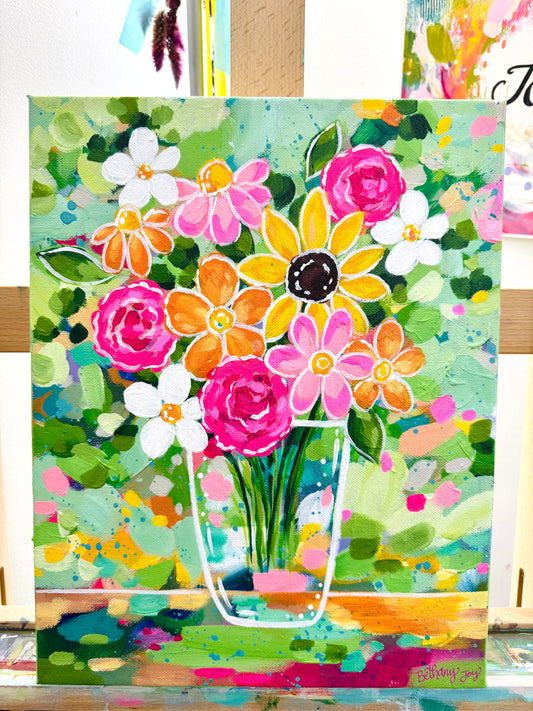 Colorful floral painting with a vase on a wooden surface