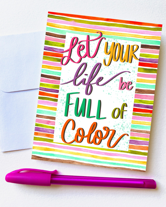 Colorful greeting card with motivational text and a pink pen on a white background